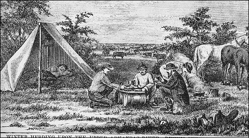 men squatting at a makeshift table of a board over two small barrels, and a man sleeping in a tent in the background